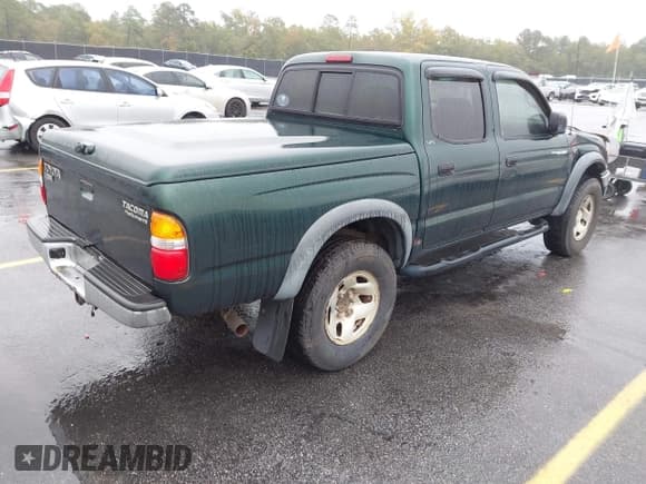 ✅ 2002 Toyota Tacoma PreRunner • VIN: 5TEGN92N32Z005211 • Lot: 43533583. Listed on IAAI with 208,552 mi. Free auction sales archive from the USA and detailed vehicle history report at DreamBid. Image 4.