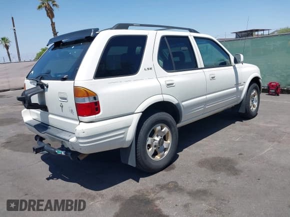 ✅ 1999 Isuzu Rodeo S • VIN: 4S2CK58W7X4325703 • Lot: 42715480. Listed on IAAI with 205,420 mi. Free auction sales archive from the USA and detailed vehicle history report at DreamBid. Image 4.