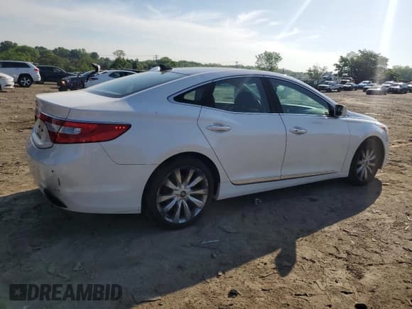 ✅ 2013 Hyundai Azera • VIN: KMHFH4JG6DA262297 • Лот: 56781155. Опубликован ранее на Copart с пробегом 234 793 миль. Бесплатный доступ к архиву аукционных продаж из США и подробный отчёт об истории автомобиля на DreamBid. Изображение 3.