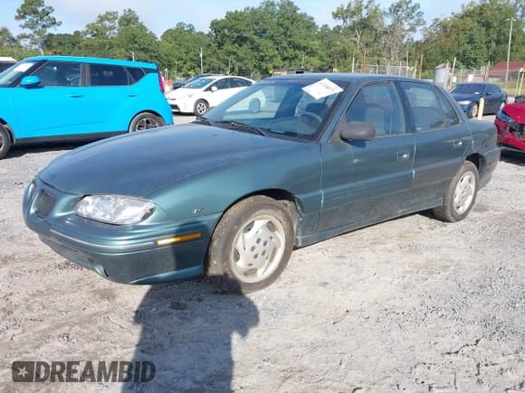 ✅ 1996 Pontiac Grand Am SE • VIN: 1G2NE52M7TC721718 • Lot: 43268073. Wystawiony na IAAI z przebiegiem 115 223 mil. Bezpłatny archiwum sprzedaży aukcyjnych z USA i szczegółowy raport historii pojazdu na DreamBid. Zdjęcie 2.