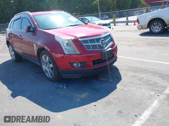 ✅ 2012 Cadillac SRX Performance Collection • VIN: 3GYFNBE31CS571210 • Lot: 43251543. Listed on IAAI with 186,568 mi. Free auction sales archive from the USA and detailed vehicle history report at DreamBid. Image 1.