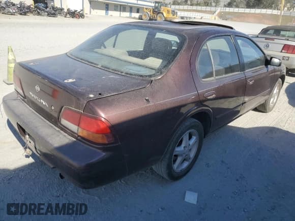 ✅ 1997 Nissan Maxima GXE • VIN: JN1CA21D3VT817964 • Lot: 77006234. Listed on Copart with 242,557 mi. Free auction sales archive from the USA and detailed vehicle history report at DreamBid. Image 3.