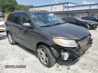 2012 Hyundai Santa Fe Limited с VIN 5XYZK4AG5CG154058, выставлен на аукционе Copart как лот 67898394 с пробегом 94 880 миль миль и Списание • Salvage title. История ставок и продаж доступна на DreamBid. Изображение 4.