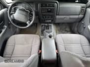 ✅ 1997 Jeep Cherokee Sport • VIN: 1J4FJ68S5VL539634 • Lot: 82171165. Listed on Copart with 266,479 mi. Free auction sales archive from the USA and detailed vehicle history report at DreamBid. Image 8.