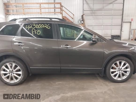 ✅ 2015 Mazda CX-9 Grand Touring • VIN: JM3TB3DA0F0464448 • Лот: 42385026. Опубликован ранее на IAAI с пробегом 118 203 миль. Бесплатный доступ к архиву аукционных продаж из США и подробный отчёт об истории автомобиля на DreamBid. Изображение 14.