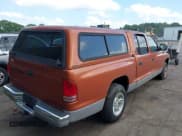 ✅ 2000 Dodge Dakota Sport • VIN: 1B7GL2AZ6YS634945 • Lot: 42335078. Wystawiony na IAAI z przebiegiem 195 618 mil. Bezpłatny archiwum sprzedaży aukcyjnych z USA i szczegółowy raport historii pojazdu na DreamBid. Zdjęcie 4.