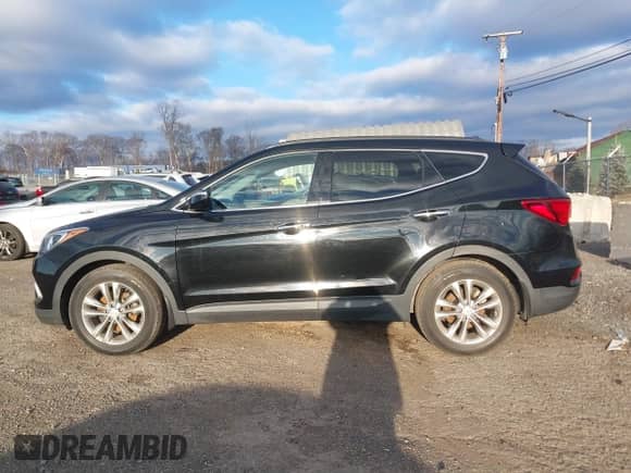 2017 Hyundai Santa Fe 2.0T z VIN 5XYZUDLA8HG502333, wystawiony jako IAAI lot #41246195 z przebiegiem 62 772 mil mil oraz . Historia ofert i sprzedaży dostępna na DreamBid. Obrazek 14.