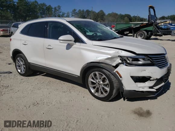 ✅ 2016 Lincoln MKC Select • VIN: 5LMTJ2DH2GUJ29987 • Lot: 77455344. Listed on Copart with 124,072 mi. Free auction sales archive from the USA and detailed vehicle history report at DreamBid. Image 4.