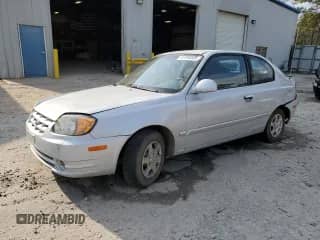 2003 Hyundai Accent GL with VIN KMHCG35CX3U270374, listed as a Copart auction lot 47240325 with 122,739 mi miles and Salvage title. Bid and sale history available at DreamBid. Image 1.
