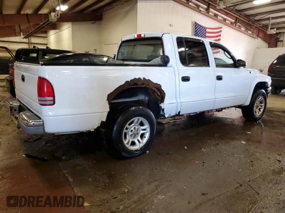 2004 Dodge Dakota SLT z VIN 1D7HG48N14S609085, wystawiony jako Copart lot #68557614 z przebiegiem Nie podano mil oraz Czysty tytuł • Clean title. Historia ofert i sprzedaży dostępna na DreamBid. Obrazek 3.