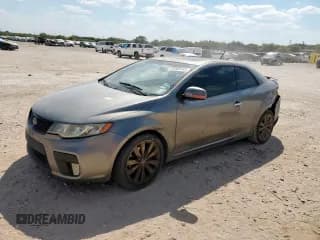 ✅ 2012 Kia Forte SX • VIN: KNAFW6A36C5517604 • Lot: 82009565. Listed on Copart with 174,115 mi. Free auction sales archive from the USA and detailed vehicle history report at DreamBid. Image 1.