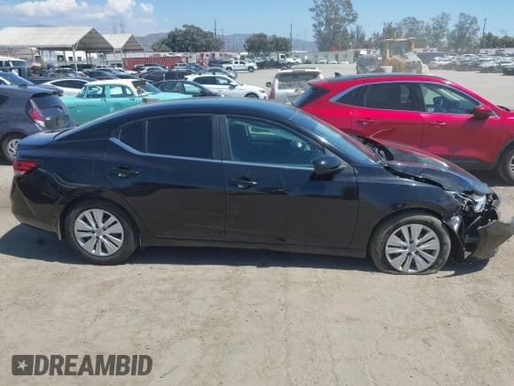 ✅ 2021 Nissan Sentra S • VIN: 3N1AB8BV1MY303292 • Лот: 43130942. Опубликован ранее на IAAI с пробегом 96 842 миль. Бесплатный доступ к архиву аукционных продаж из США и подробный отчёт об истории автомобиля на DreamBid. Изображение 13.