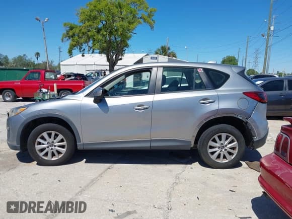 ✅ 2015 Mazda CX-5 Sport • VIN: JM3KE2BEXF0527431 • Lot: 41832024. Listed on IAAI with 131,215 mi. Free auction sales archive from the USA and detailed vehicle history report at DreamBid. Image 14.