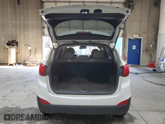 2014 Hyundai Tucson Limited with VIN KM8JUCAG2EU806309, listed as a Copart auction lot 66015735 with 104,328 mi miles and Salvage title. Bid and sale history available at DreamBid. Image 6.