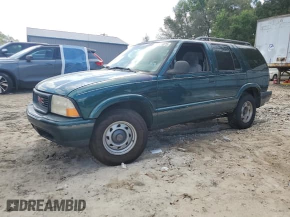 ✅ 1998 GMC Jimmy SL • VIN: 1GKCS13W8W2500566 • Лот: 51211875. Опубликован ранее на Copart с пробегом Не указан. Бесплатный доступ к архиву аукционных продаж из США и подробный отчёт об истории автомобиля на DreamBid. Изображение 1.