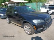 ✅ 2011 BMW X5 35i • VIN: 5UXZV4C54BL409383 • Lot: 43054694. Listed on IAAI with 151,407 mi. Free auction sales archive from the USA and detailed vehicle history report at DreamBid. Image 1.