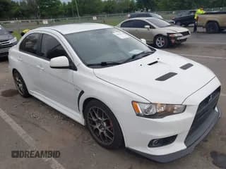 ✅ 2014 Mitsubishi Lancer Evolution MR • VIN: JA32W5FV5EU001926 • Lot: 42873376. Wystawiony na IAAI z przebiegiem 99 949 mil. Bezpłatny archiwum sprzedaży aukcyjnych z USA i szczegółowy raport historii pojazdu na DreamBid. Zdjęcie 1.