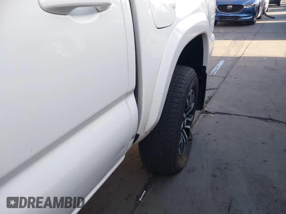 ✅ 2023 Toyota Tacoma SR5 • VIN: 3TMAZ5CNXPM208862 • Lot: 42206860. Listed on IAAI with 11,354 mi. Free auction sales archive from the USA and detailed vehicle history report at DreamBid. Image 6.