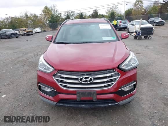 2017 Hyundai Santa Fe 2.4L z VIN 5XYZUDLB2HG385082, wystawiony jako IAAI lot #43416115 z przebiegiem Nie podano mil oraz . Historia ofert i sprzedaży dostępna na DreamBid. Obrazek 11.