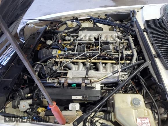 ✅ 1989 Jaguar XJS • VIN: SAJNV4846KC158092 • Лот: 77359824. Опубликован ранее на Copart с пробегом 73 974 миль. Бесплатный доступ к архиву аукционных продаж из США и подробный отчёт об истории автомобиля на DreamBid. Изображение 11.