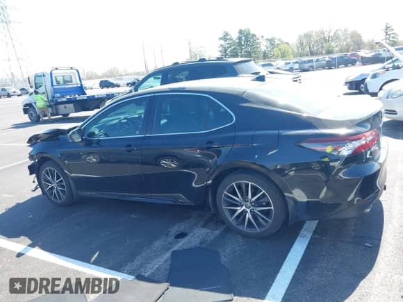 2022 Toyota Camry Hybrid XLE with VIN 4T1F31AK5NU594457, listed as a IAAI auction lot 41884438 with 69,767 mi miles and . Bid and sale history available at DreamBid. Image 14.