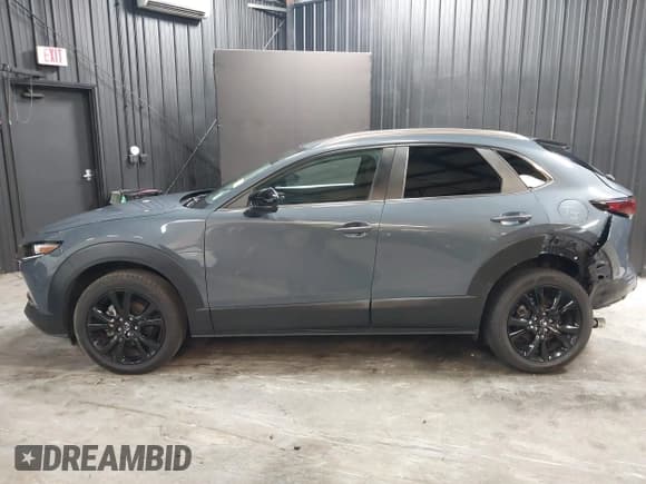 ✅ 2022 Mazda CX-30 S Carbon Edition • VIN: 3MVDMBCL8NM447234 • Lot: 42511600. Listed on IAAI with 51,926 mi. Free auction sales archive from the USA and detailed vehicle history report at DreamBid. Image 14.