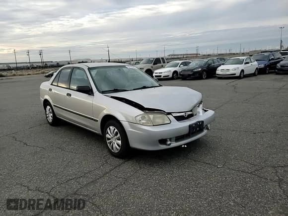 ✅ 1999 Mazda Protege DX • VIN: JM1BJ2226X0160801 • Лот: 92123945. Опубликован ранее на Copart с пробегом 212 596 миль. Бесплатный доступ к архиву аукционных продаж из США и подробный отчёт об истории автомобиля на DreamBid. Изображение 13.