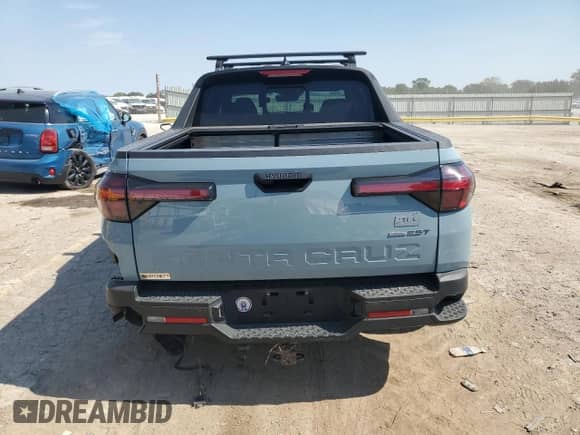 2022 Hyundai Santa Cruz SEL Premium с VIN 5NTJDDAF0NH036527, выставлен на аукционе Copart как лот 73773794 с пробегом 31 049 миль миль и Списание • Salvage title. История ставок и продаж доступна на DreamBid. Изображение 6.