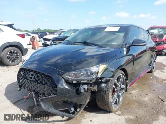 2020 Hyundai Veloster z VIN KMHT36AH9LU007422, wystawiony jako IAAI lot #42513370 z przebiegiem 102 805 mil mil oraz . Historia ofert i sprzedaży dostępna na DreamBid. Obrazek 2.