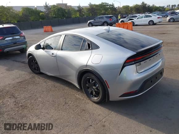 2025 Toyota Prius LE with VIN JTDACAAU4S3052719, listed as a IAAI auction lot 43175096 with 23,082 mi miles and . Bid and sale history available at DreamBid. Image 3.