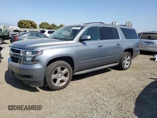 ✅ 2018 Chevrolet Suburban LS • VIN: 1GNSCGKC1JR194249 • Lot: 61763195. Listed on Copart with 91,517 mi. Free auction sales archive from the USA and detailed vehicle history report at DreamBid. Image 1.