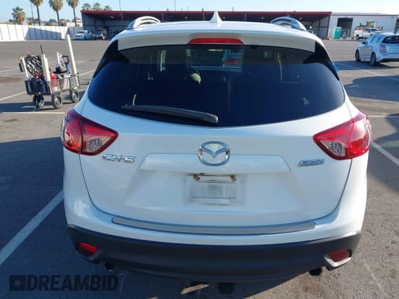 ✅ 2014 Mazda CX-5 Grand Touring • VIN: JM3KE2DY4E0307773 • Lot: 43643721. Wystawiony na IAAI z przebiegiem 117 548 mil. Bezpłatny archiwum sprzedaży aukcyjnych z USA i szczegółowy raport historii pojazdu na DreamBid. Zdjęcie 16.