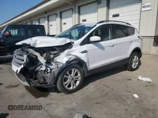 2018 Ford Escape SE с VIN 1FMCU9GD7JUC02144, выставлен на аукционе Copart как лот 72063325 с пробегом 173 851 миль миль и Списание • Salvage title. История ставок и продаж доступна на DreamBid. Изображение 1.