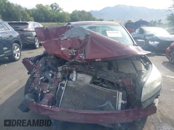 2015 Chevrolet Malibu LT z VIN 1G11C5SL6FF281154, wystawiony jako IAAI lot #43266898 z przebiegiem 164 798 mil mil oraz . Historia ofert i sprzedaży dostępna na DreamBid. Obrazek 13.