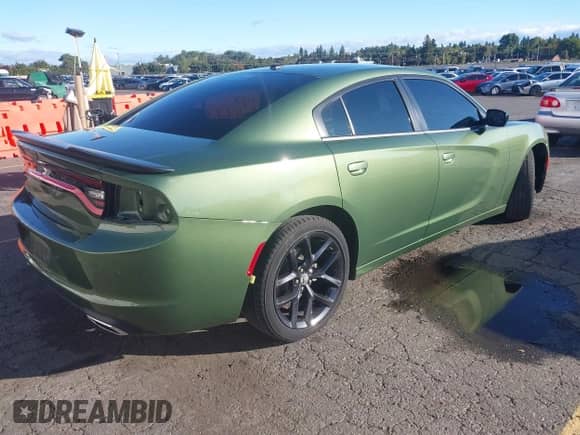 2022 Dodge Charger SXT with VIN 2C3CDXBG5NH202361, listed as a IAAI auction lot 43406992 with 34,449 mi miles and . Bid and sale history available at DreamBid. Image 4.