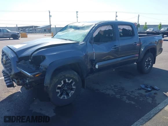 ✅ 2021 Toyota Tacoma SR • VIN: 3TMCZ5AN2MM387079 • Lot: 42164603. Listed on IAAI with 42,794 mi. Free auction sales archive from the USA and detailed vehicle history report at DreamBid. Image 2.