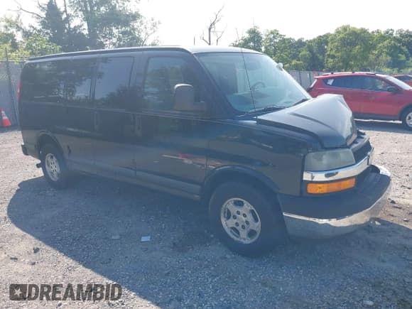 ✅ 2005 Chevrolet Express Passenger • VIN: 1GNFG15T751169844 • Lot: 42393893. Listed on IAAI with 226,673 mi. Free auction sales archive from the USA and detailed vehicle history report at DreamBid. Image 1.
