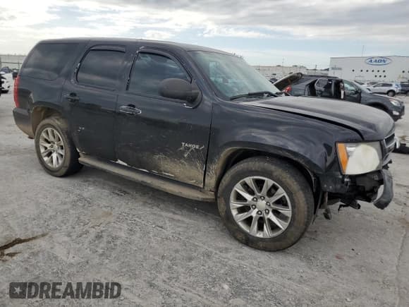 ✅ 2014 Chevrolet Tahoe Commercial • VIN: 1GNLC2E08ER142356 • Lot: 62602785. Listed on Copart with 98,653 mi. Free auction sales archive from the USA and detailed vehicle history report at DreamBid. Image 4.