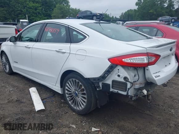 ✅ 2013 Ford Fusion Titanium Hybrid • VIN: 3FA6P0RU6DR315585 • Lot: 42598359. Listed on IAAI with 153,669 mi. Free auction sales archive from the USA and detailed vehicle history report at DreamBid. Image 3.