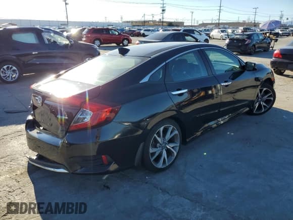 ✅ 2021 Honda Civic Touring • VIN: 19XFC1F99ME201406 • Lot: 82574835. Listed on Copart with 18,879 mi. Free auction sales archive from the USA and detailed vehicle history report at DreamBid. Image 3.