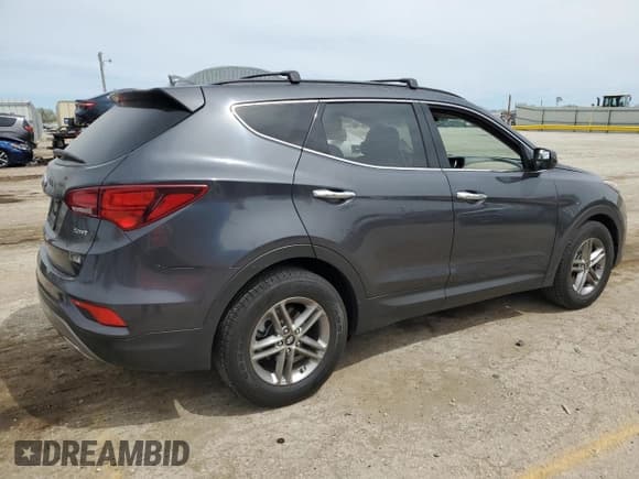 ✅ 2017 Hyundai Santa Fe 2.4L • VIN: 5XYZU3LB5HG447861 • Лот: 50052994. Опубликован ранее на Copart с пробегом 71 552 миль. Бесплатный доступ к архиву аукционных продаж из США и подробный отчёт об истории автомобиля на DreamBid. Изображение 3.