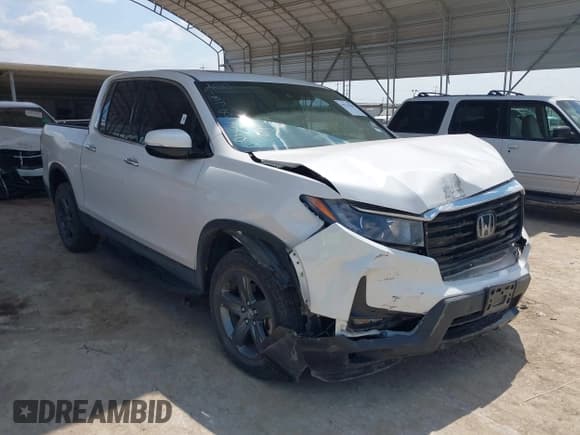 ✅ 2023 Honda Ridgeline RTL-E • VIN: 5FPYK3F72PB035287 • Lot: 43234228. Listed on IAAI with 15,634 mi. Free auction sales archive from the USA and detailed vehicle history report at DreamBid. Image 1.