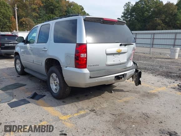 2012 Chevrolet Tahoe LT with VIN 1GNSCBE07CR196854, listed as a IAAI auction lot 43493508 with 206,756 mi miles and . Bid and sale history available at DreamBid. Image 3.