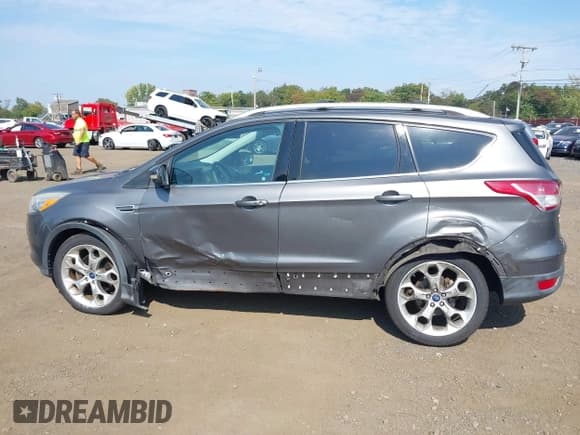 ✅ 2013 Ford Escape Titanium • VIN: 1FMCU9J99DUB51397 • Lot: 43286662. Listed on IAAI with 133,274 mi. Free auction sales archive from the USA and detailed vehicle history report at DreamBid. Image 17.
