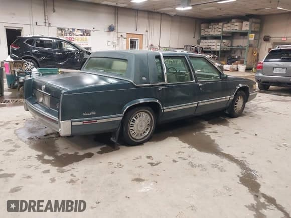 ✅ 1992 Cadillac DeVille • VIN: 1G6CD53B2N4227608 • Lot: 42190714. Listed on IAAI with 123,256 mi. Free auction sales archive from the USA and detailed vehicle history report at DreamBid. Image 4.