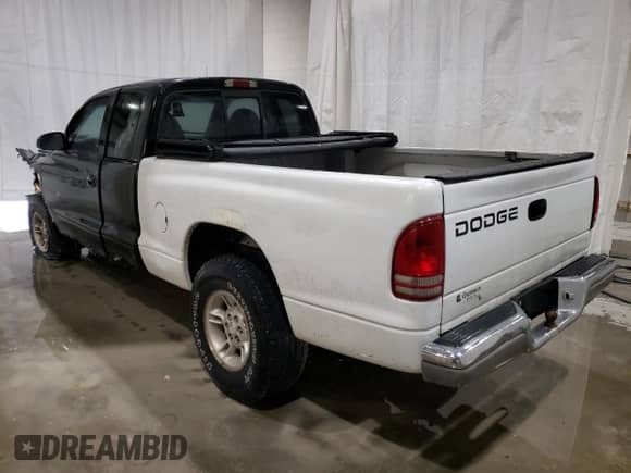 1997 Dodge Dakota with VIN 1B7GG23X0VS253118, listed as a Copart auction lot 74597754 with 157,636 mi miles and Salvage title. Bid and sale history available at DreamBid. Image 2.