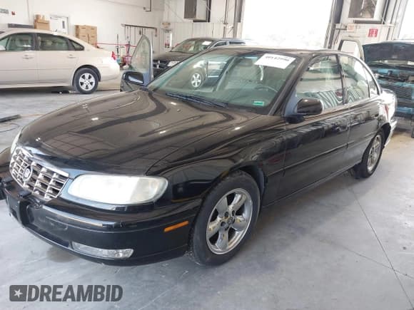 ✅ 1997 Cadillac Catera • VIN: W06VR54R9VR162389 • Lot: 40142990. Listed on IAAI with 111,558 mi. Free auction sales archive from the USA and detailed vehicle history report at DreamBid. Image 2.