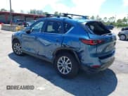 ✅ 2022 Mazda CX-5 S Carbon Edition • VIN: JM3KFBCM5N0620116 • Lot: 43033082. Listed on IAAI with 48,059 mi. Free auction sales archive from the USA and detailed vehicle history report at DreamBid. Image 3.