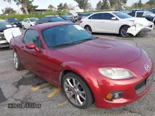 ✅ 2015 Mazda MX-5 Miata Grand Touring • VIN: JM1NC2PF9F0241793 • Lot: 43373257. Listed on IAAI with 127,984 mi. Free auction sales archive from the USA and detailed vehicle history report at DreamBid. Image 1.