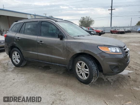 ✅ 2012 Hyundai Santa Fe GLS • VIN: 5XYZG4AG0CG153062 • Lot: 76452394. Listed on Copart with 99,354 mi. Free auction sales archive from the USA and detailed vehicle history report at DreamBid. Image 4.